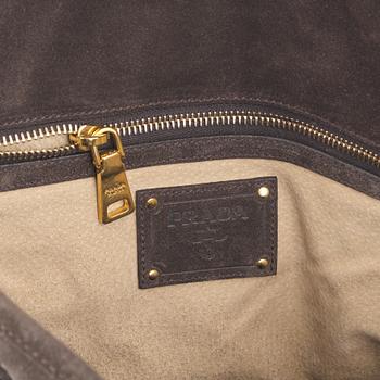 Prada, a chocolate brown suede handbag.