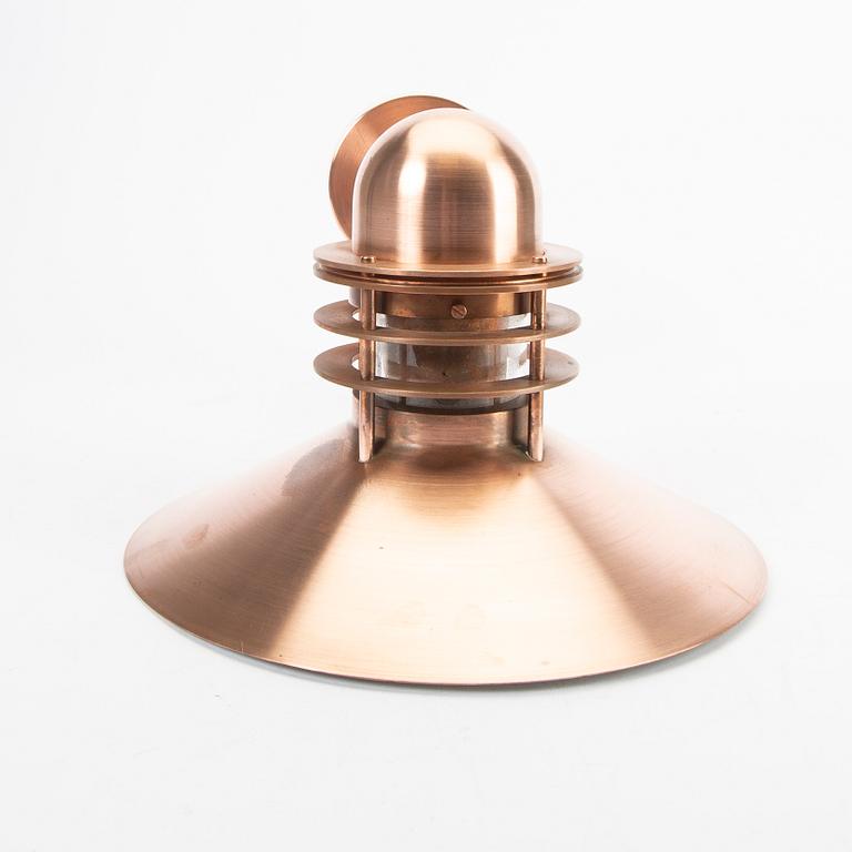 Louis Poulsen,a copper Nyhavn wall lampfrom Louis Poulsen.