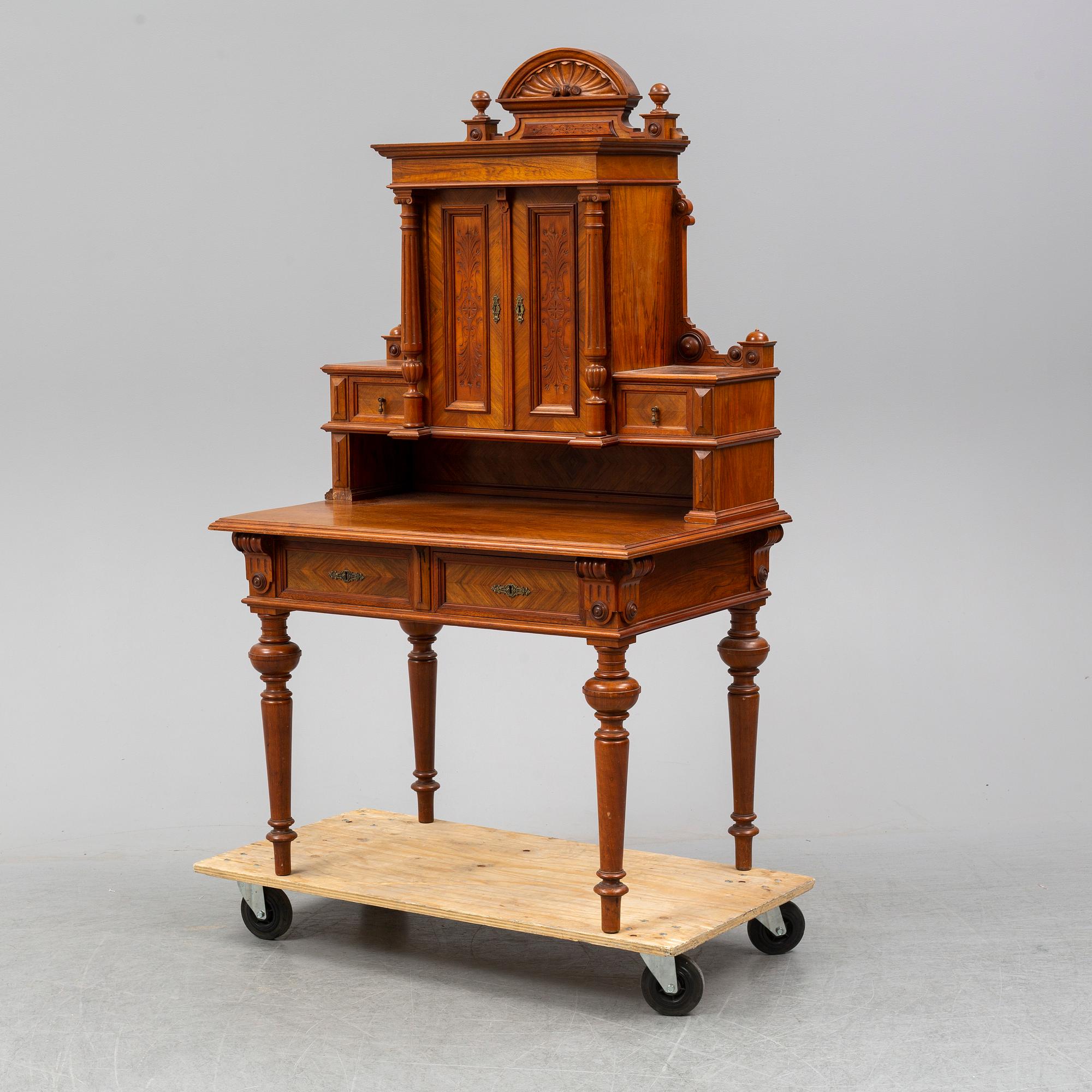 A late 19th century walnut veneered desk.