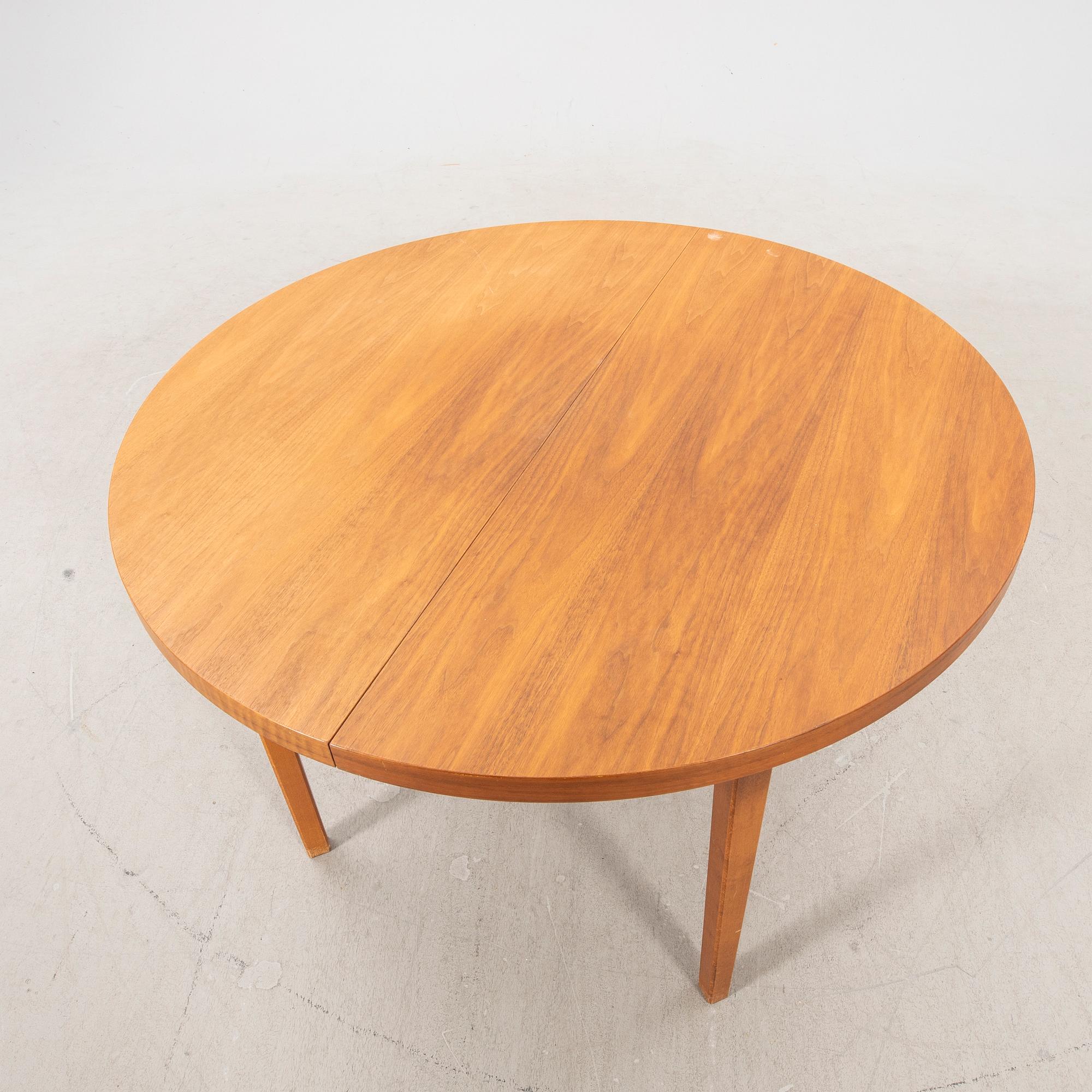 A 1960s teak dining table.