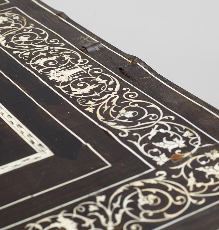 A Renaissance-style ebony, ebonized and ivory-inlaid library table, late 19th century, presumably Germany.