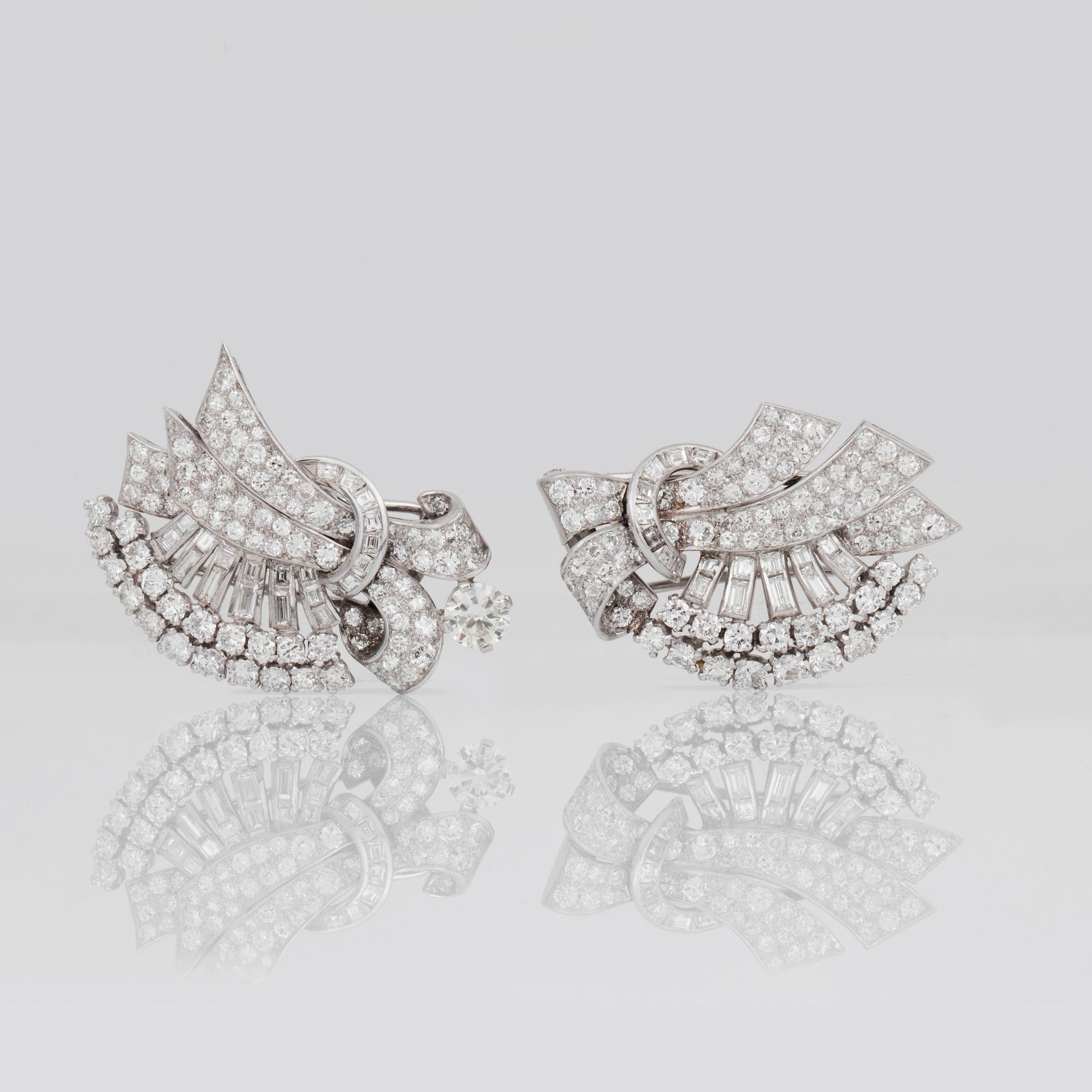 A brilliant-, baguette- and step-cut diamond brooch/double-clip.