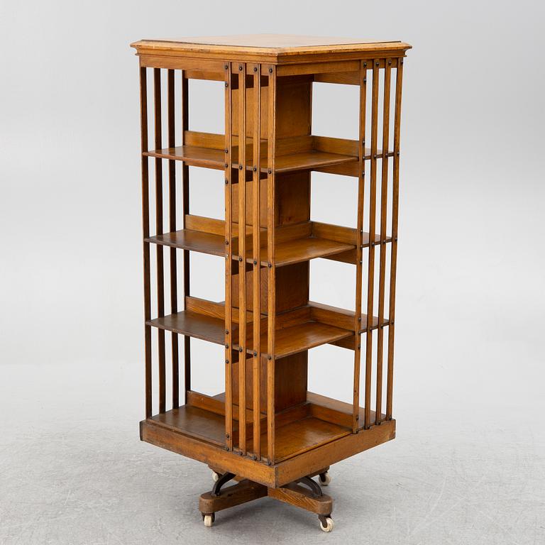 An oak Revolving bookcase by Trübner & Co, England, early 20th century.