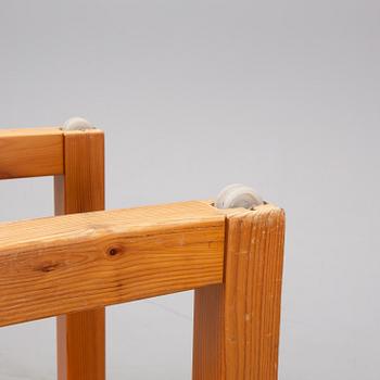 A set of six mid 20th century pine wood chairs with wheels.
