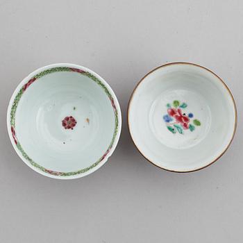 A famille rose butter tureen with cover and two cups with three odd stands, Qing dynasty, Qianlong (1736-95).