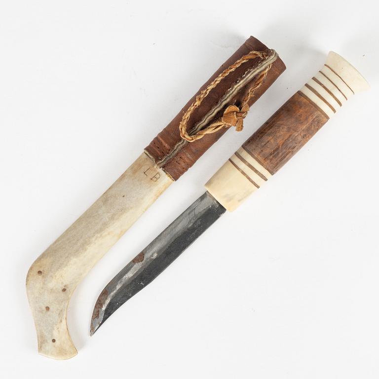 A reindeer horn knife signed LB.