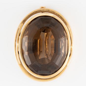 Brooch 18K gold with a faceted smoky quartz.