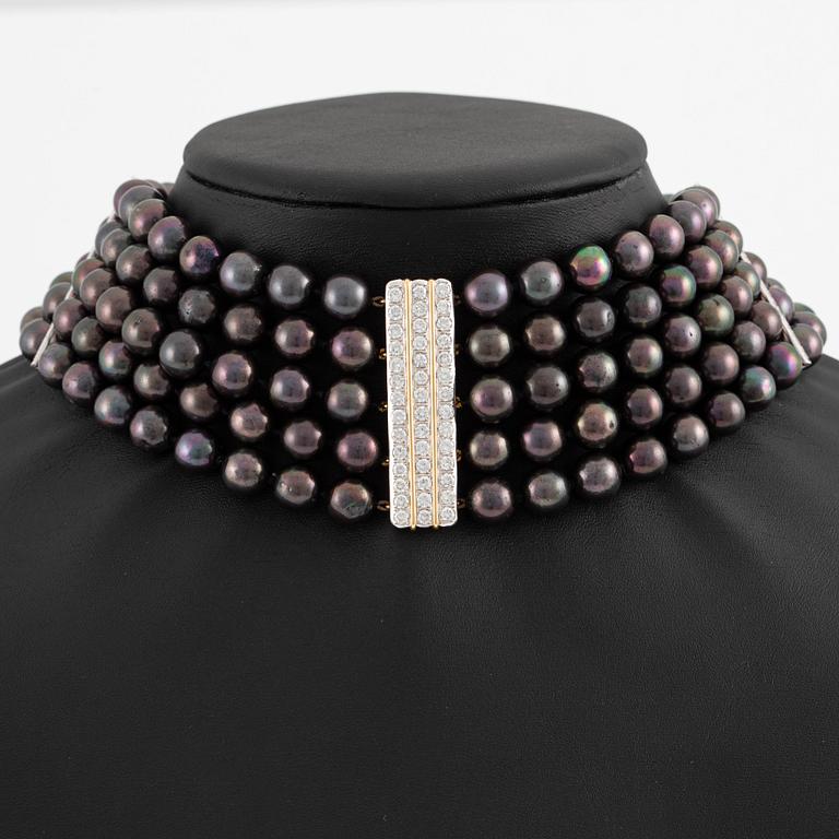 Necklace, five-row with cultured black pearls, 18K gold and white gold with brilliant-cut diamonds.