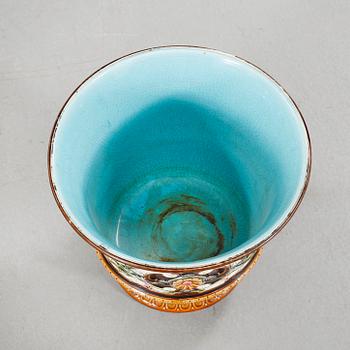A Rörstrand pedestal with pot in majolica, made around year 1900.