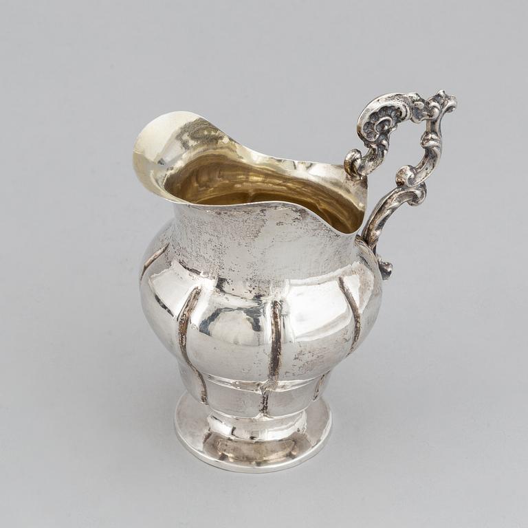 A Swedish 19th century parcel-gilt silver cream-jug, mark of Oskar Ahlström, Södertälje 1856.