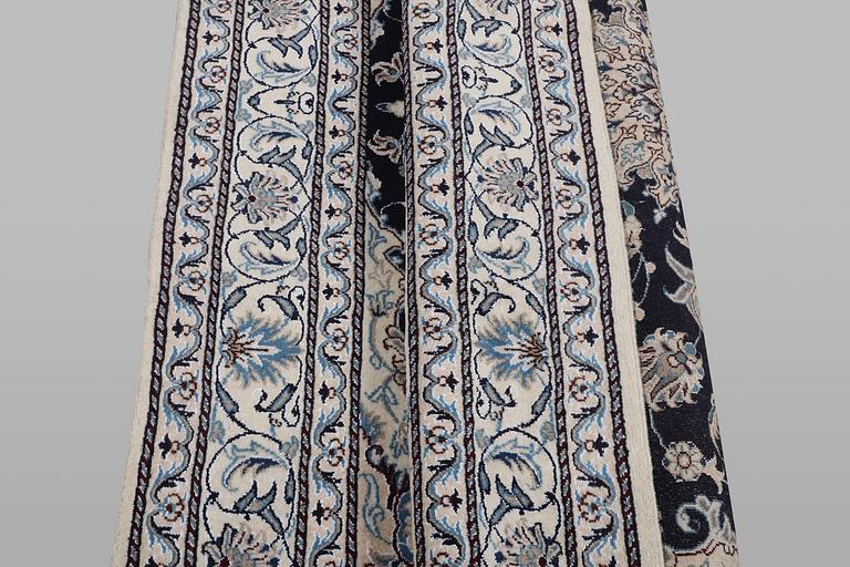 A rug, Nain, part silk, ca 198 x 144 cm.