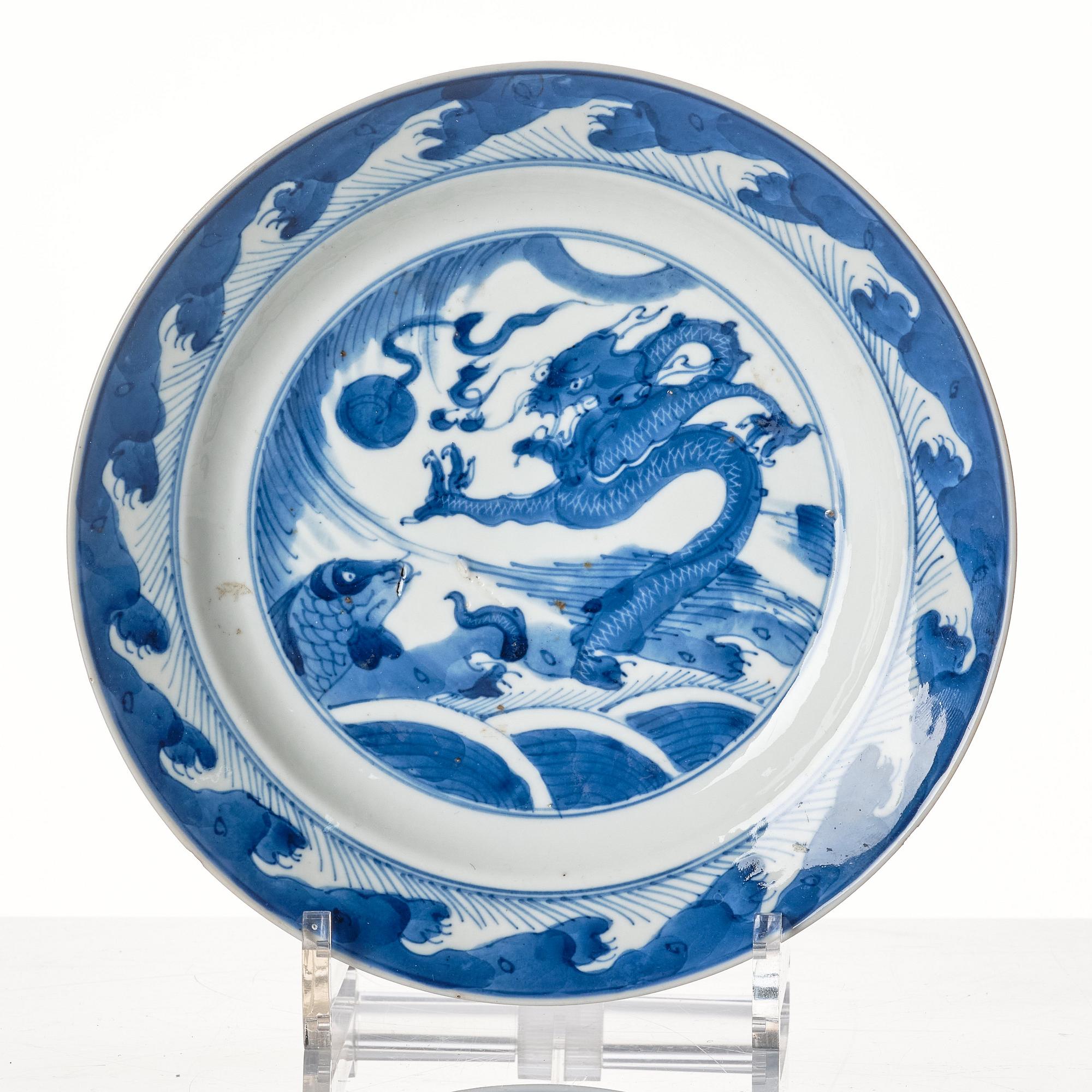 A set of four blue and white dinner plates, Qing dynasty, Kangxi (1662-1722).