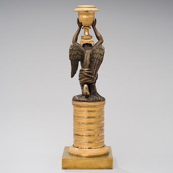 A ORMOLU CANDLESTICK, bronze and gilded bronze, empire early 19th century.