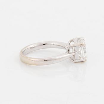 An 18K white gold ring set with an Asscher-cut diamond.