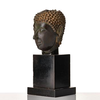 A bronze buddha head, Siam, Sawankhalok, 10th/11th Century.