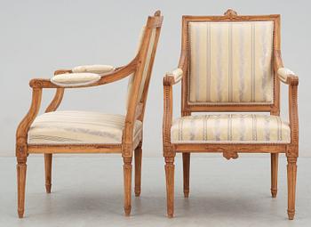 A Gustavian 18th century suite of furniture comprising a pair of armchairs and a sofa.