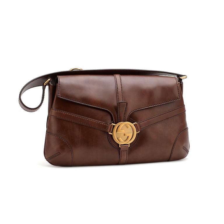 GUCCi, a brown leather shoulder bag.