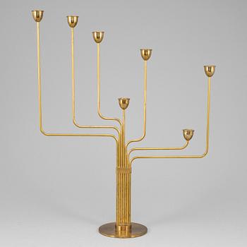 PIET HEIN, an 'Ursa Major' brass candelabrum, Denmark, designed in 1953.