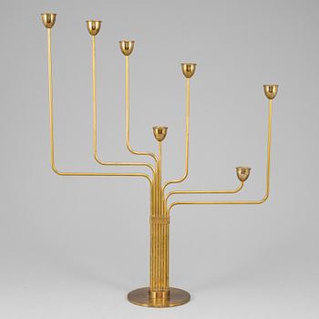 PIET HEIN, an 'Ursa Major' brass candelabrum, Denmark, designed in 1953.