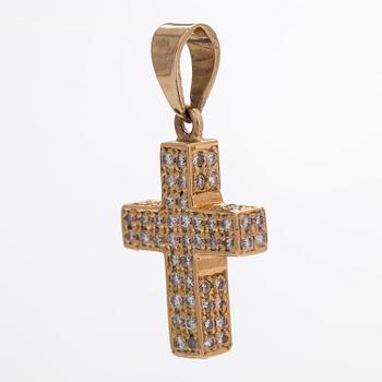 A 14K gold cross pendant with diamonds.