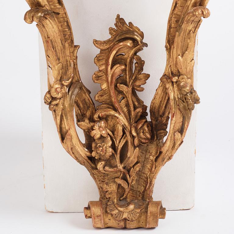 A Central European Louis XV carved and giltwood console table, mid 18th century.