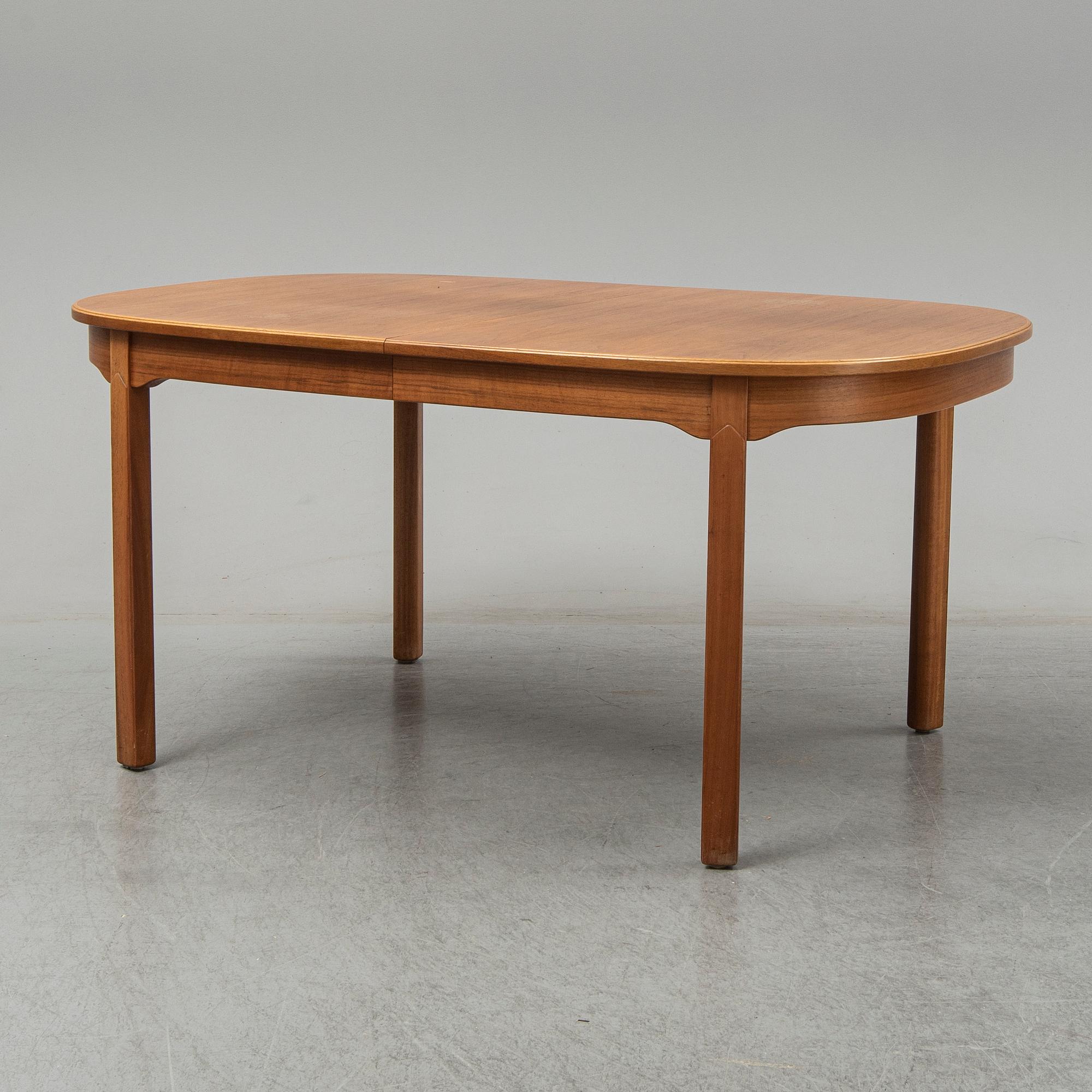 A five-piece walnut 'Ambassadör' dining suite by Carl Malmsten.