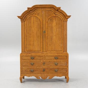 An oak veneered rococo cabinet, mid 18th Century.