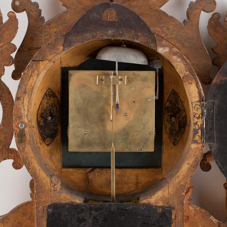 A Swedish Empire early 19th century gilt wood wall clock by I. Dahlström.