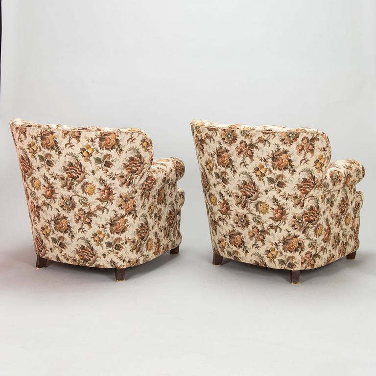 A pair of mid 20th century armchairs.