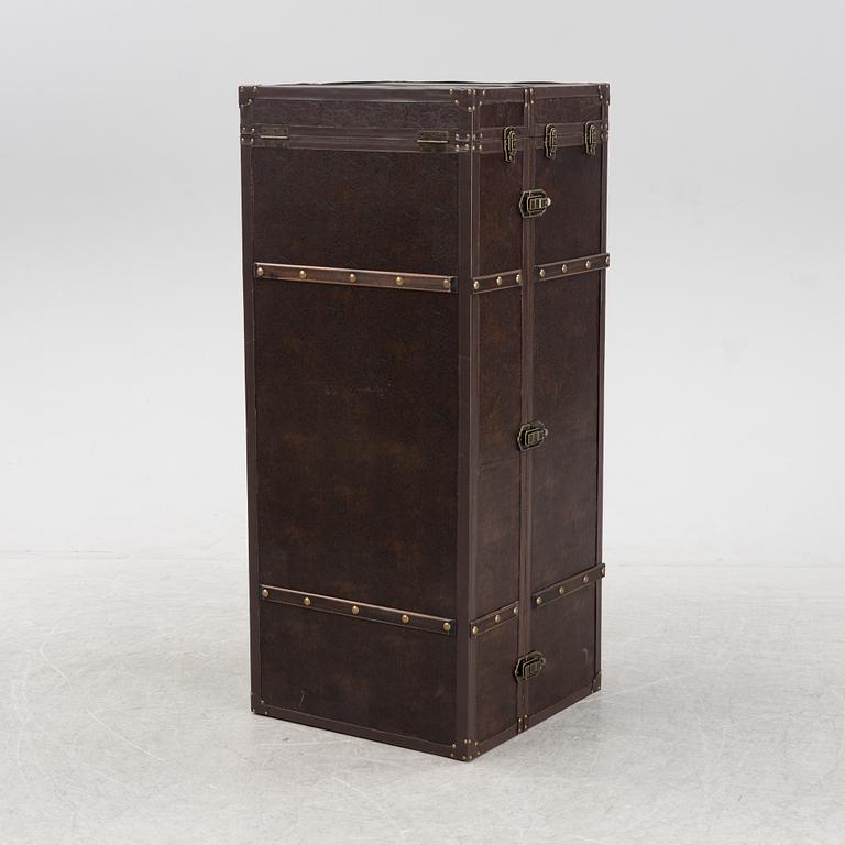 A leather suitcase-shaped bar cabinet.