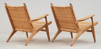 A pair of Hans J Wegner oak and rattan 'CH-27' armchairs, Carl Hansen & Søn, 1950's.