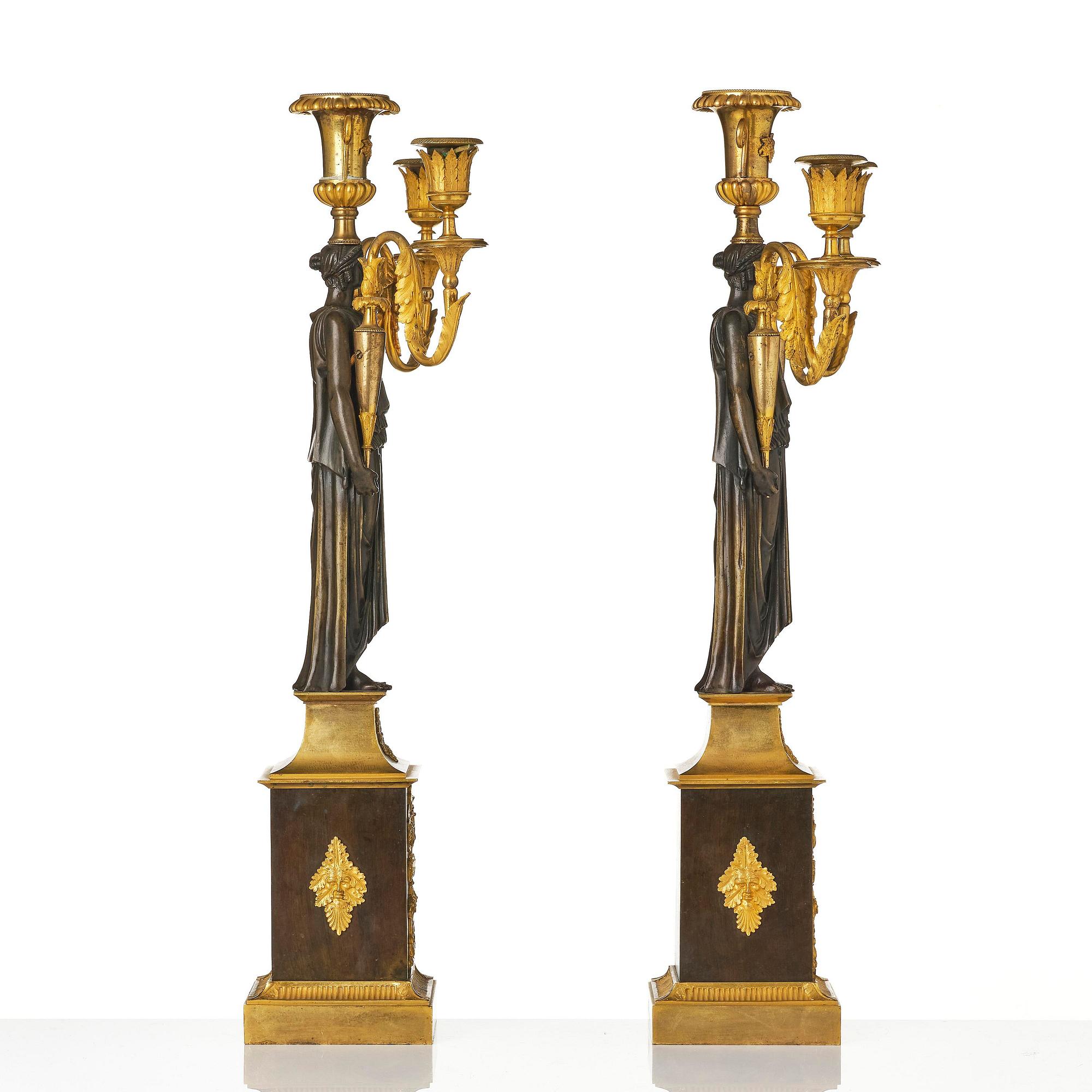 A pair of French Empire ormolu three-branch candelabra, Paris, early 19th century.