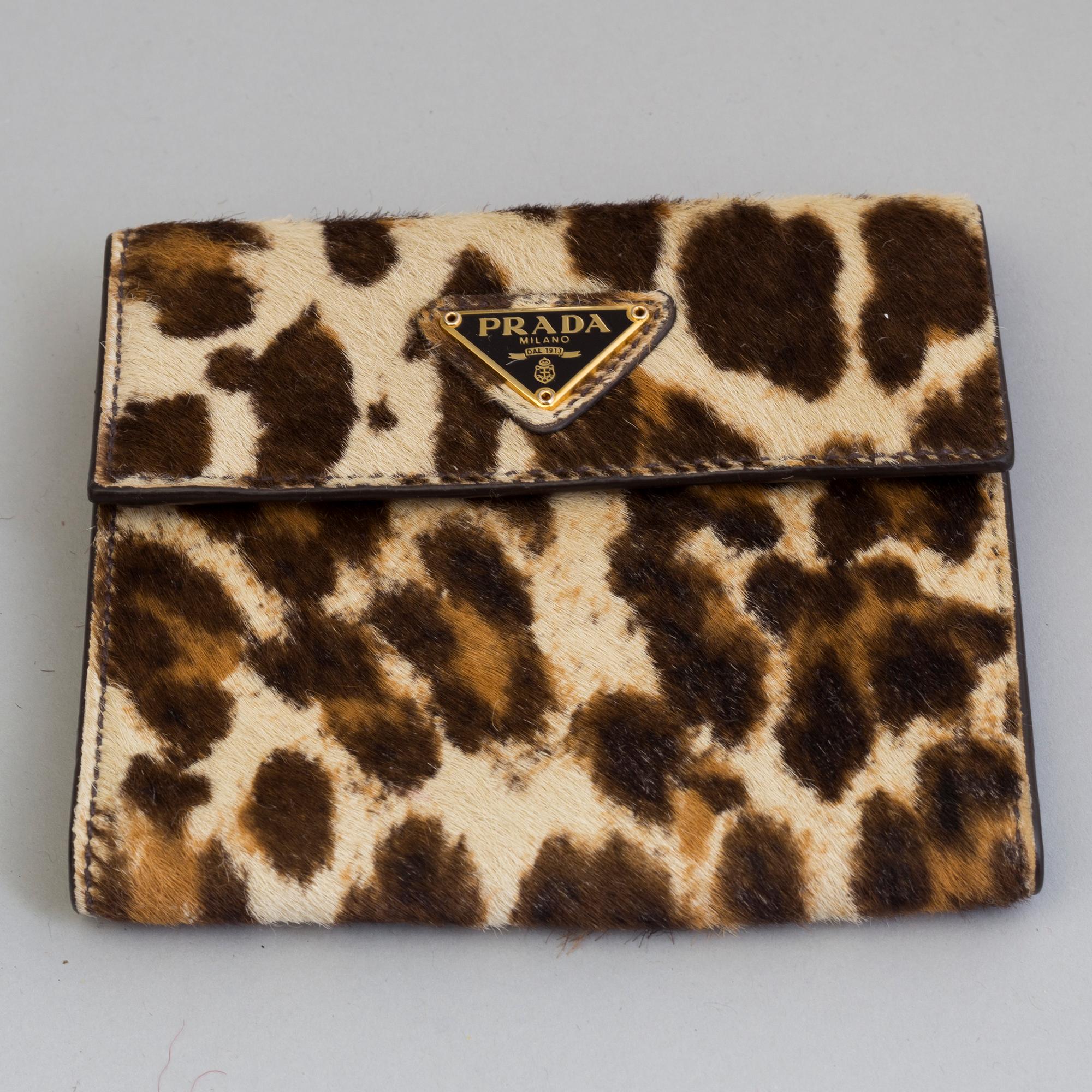A bag and a wallet by Prada pony hair. Bukowskis