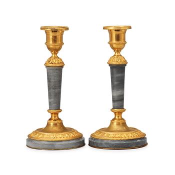 A pair of Louis XVI-style 19th century Henri Picard candlesticks.