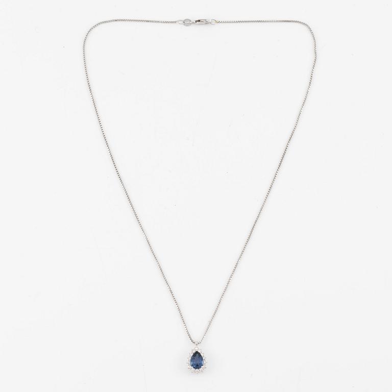 Pendant with 18K gold chain featuring a faceted sapphire and round brilliant-cut diamonds.