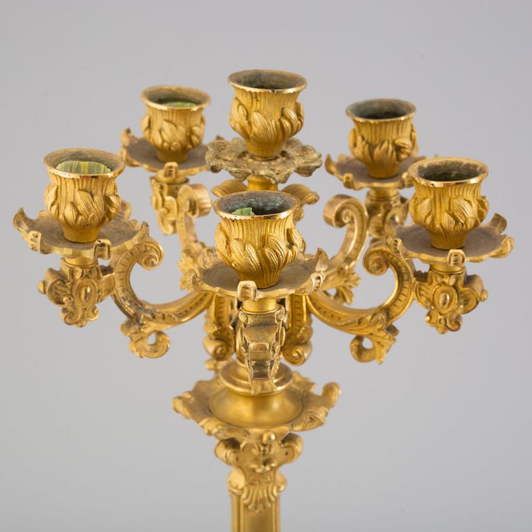 A pair of early 20th century bronze candelabras.