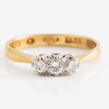 Ring 23K gold with three diamonds.