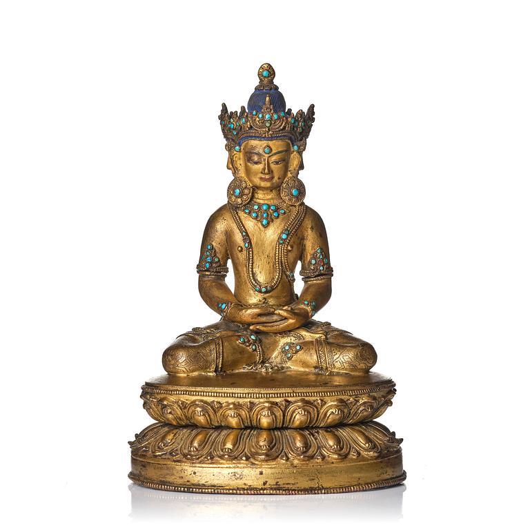 A Tibetan or Nepalese Gilt-Copper Alloy Figure of Sarvavid Vairocana, 15th century.
