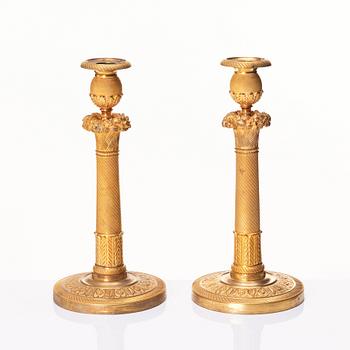 A pair of French Empire candlesticks, early 19th century.