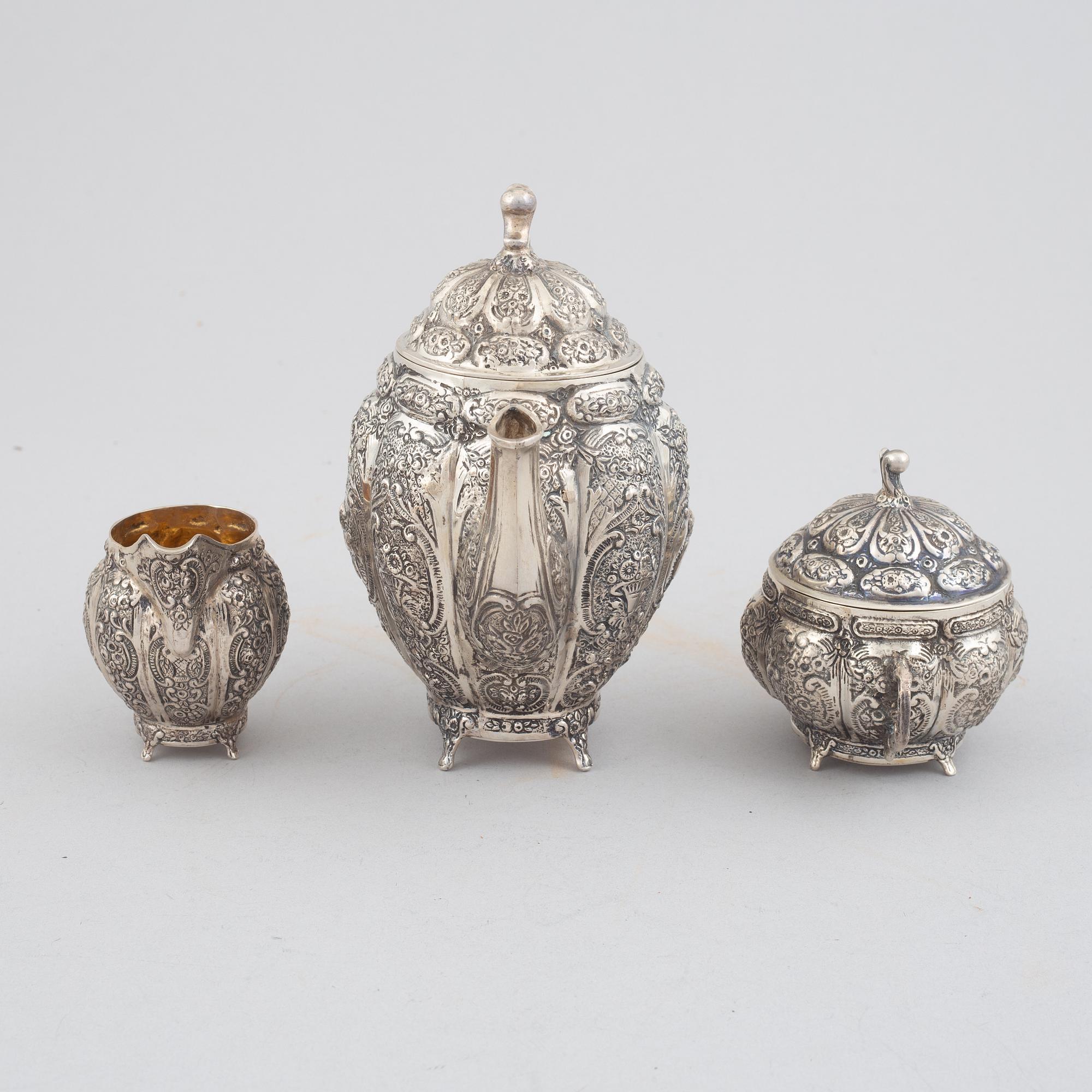 E.Jäntti, four silver cups, a three-piece silver coffee service and a silver tray, Helsinki, Finland,1979-81.