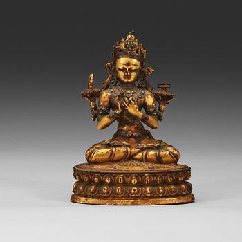 A gilt copper alloy figure of Manjushri, Nepal 15th/16th Century.