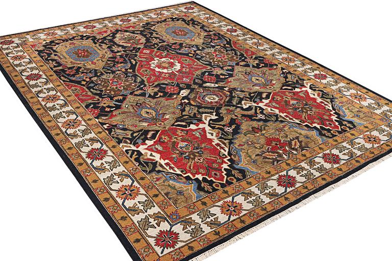 An oriental carpet with Mamluk design, c. 364 x 276 cm.