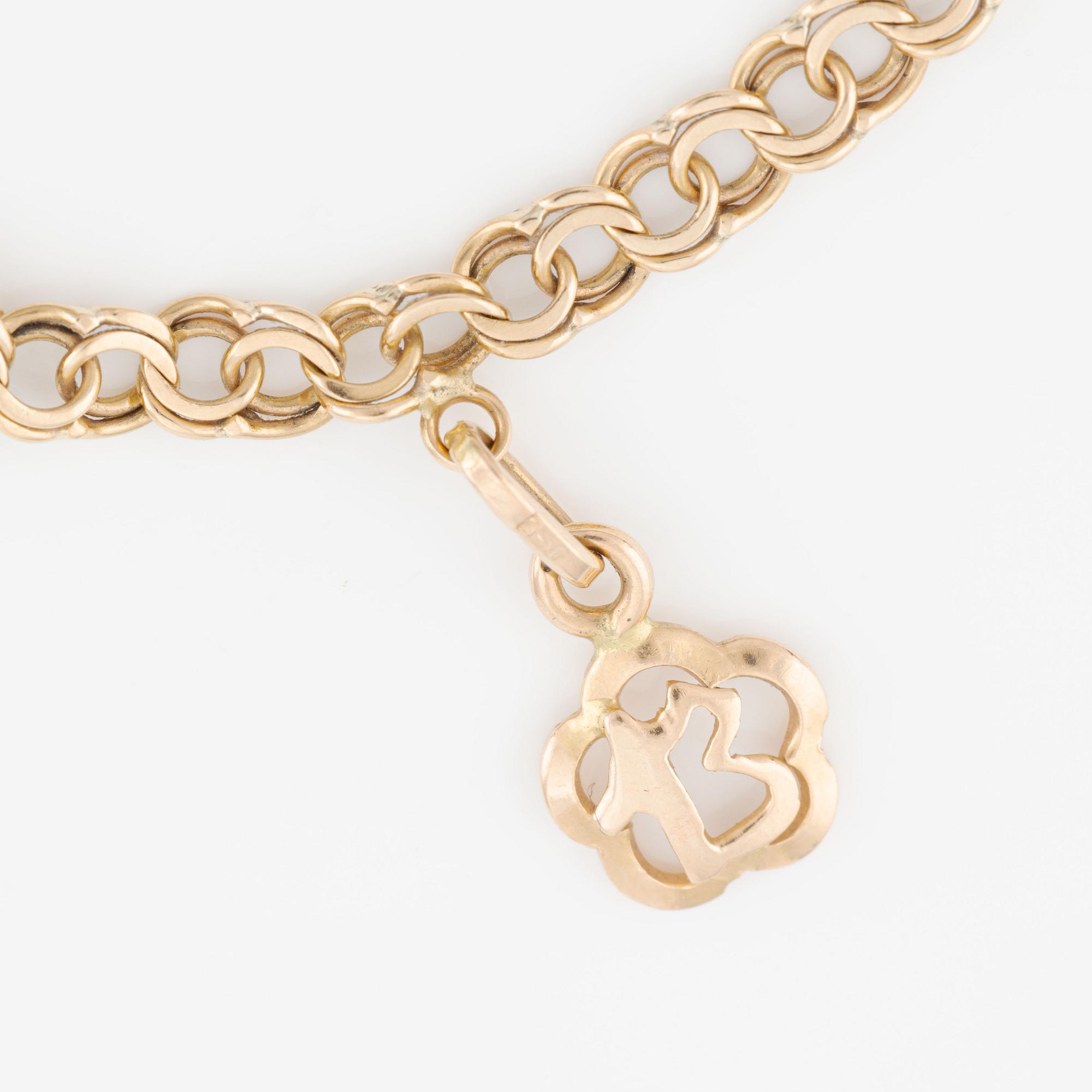 Armband, 18K guld med berlocker.