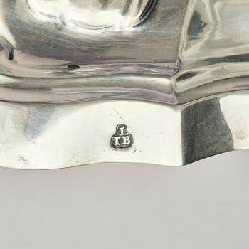 A pair of German silver Rococo candlesticks, marks of Johann Jacob Baur, Augsburg 1777-1779.