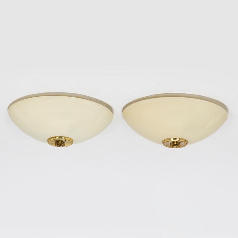A pair of mid-20th century 'EA 72 ceiling lights for Itsu.