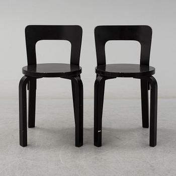 ALVAR AALTO, a pair of painted model 65 chairs from Artek, Finland.