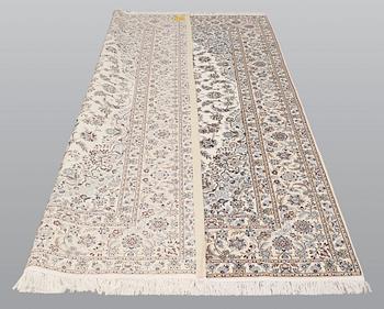 A carpet, Nain part silk s.k 6LAA, ca 310 X 209 cm.