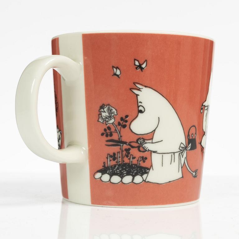 A Moomin mug, 'Dark rosa' with sticker, Arabia, Finland, 1991-99.