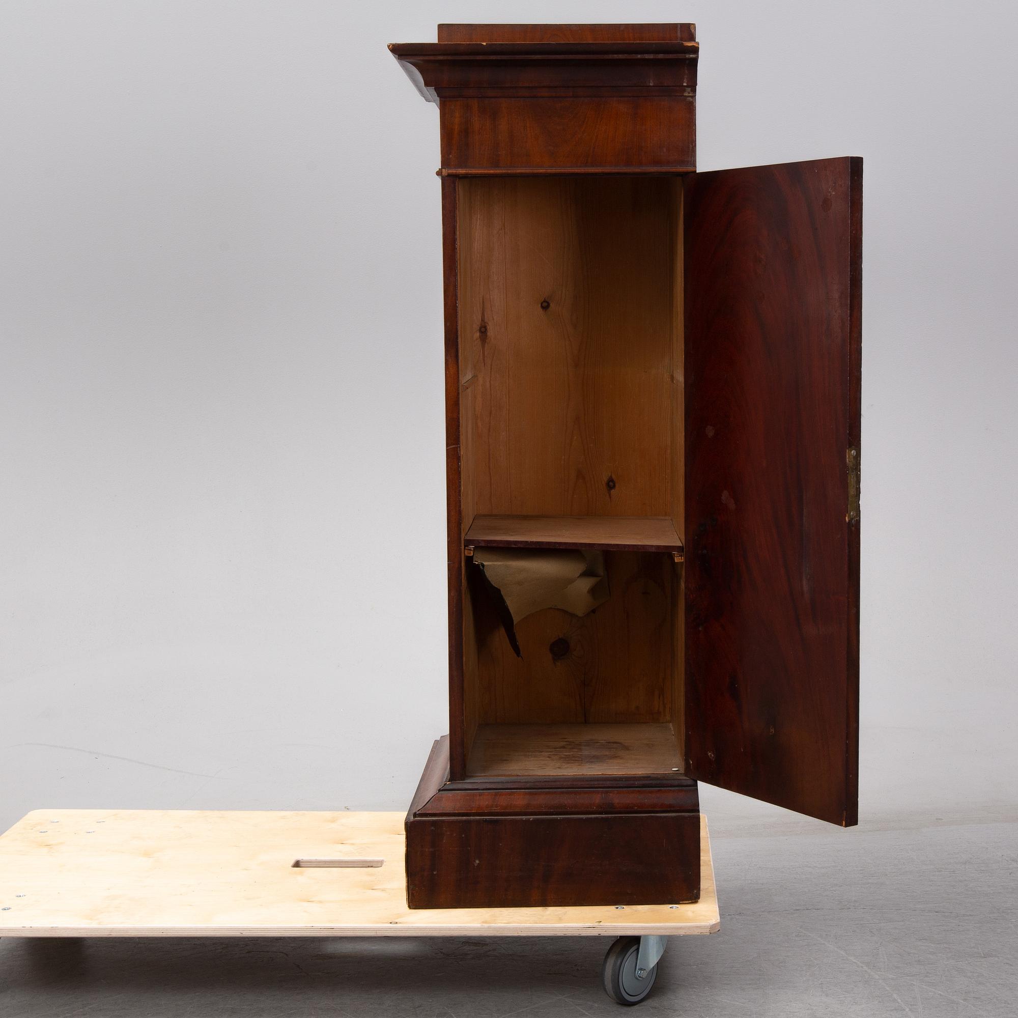 An early 19th Century empire mahogany cabinet.