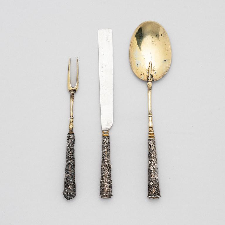A possibly German 17/18th century parcel-gilt silver and filigree three-piece travel cutlery, unmarked.